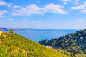 Enjoy breathtaking views of the sea and distant mountains from this serene coastal retreat.