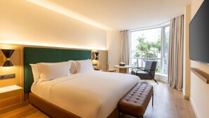 A hotel room with a large bed, a bench, a desk, a chair, and a TV. - Best Western Plus Casablanca City Center (Casablanca)