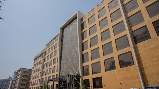 A modern building with a grid of windows and a unique geometric facade. - Rosemond Al Hamra (Jeddah)