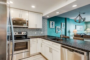 Fridge, microwave, oven, stovetop - Oceanfront condo with balcony, central AC, W/D, & indoor pool - steps to beach (North Myrtle Beach)