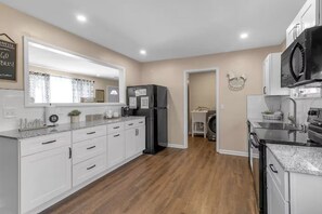 Coffee/tea maker, fridge, microwave, oven