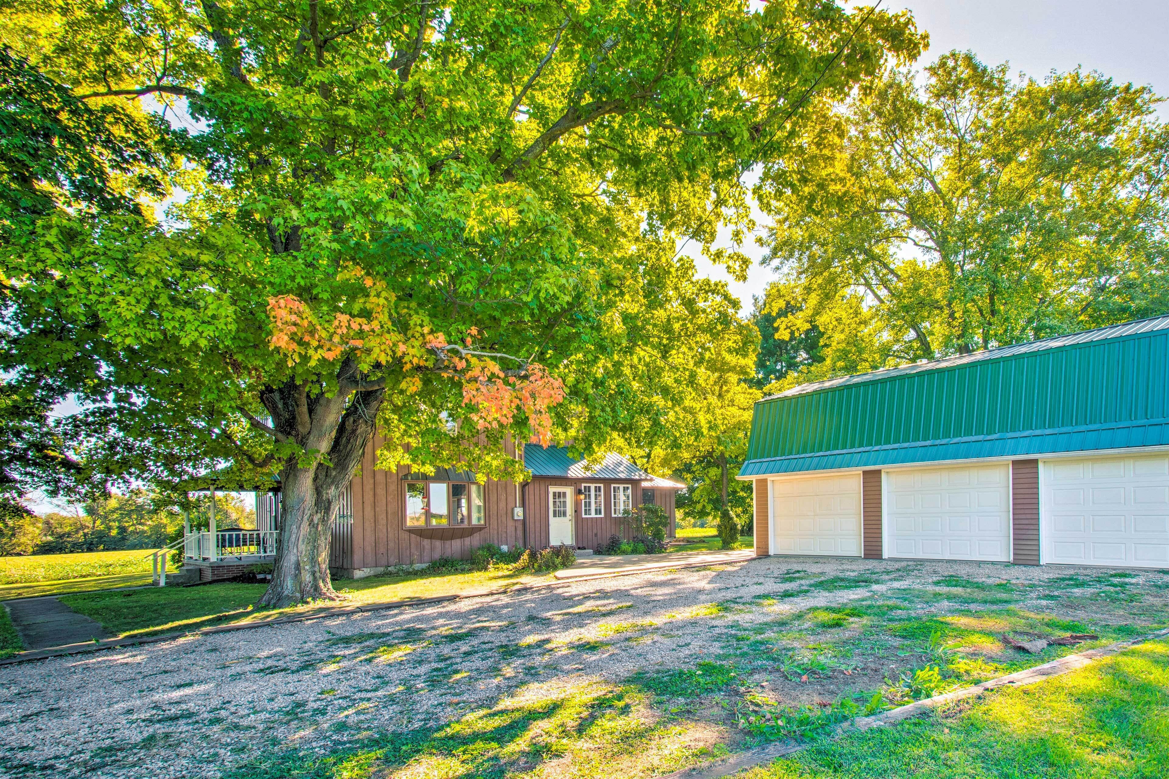 A two-story building with a green roof and a garage.