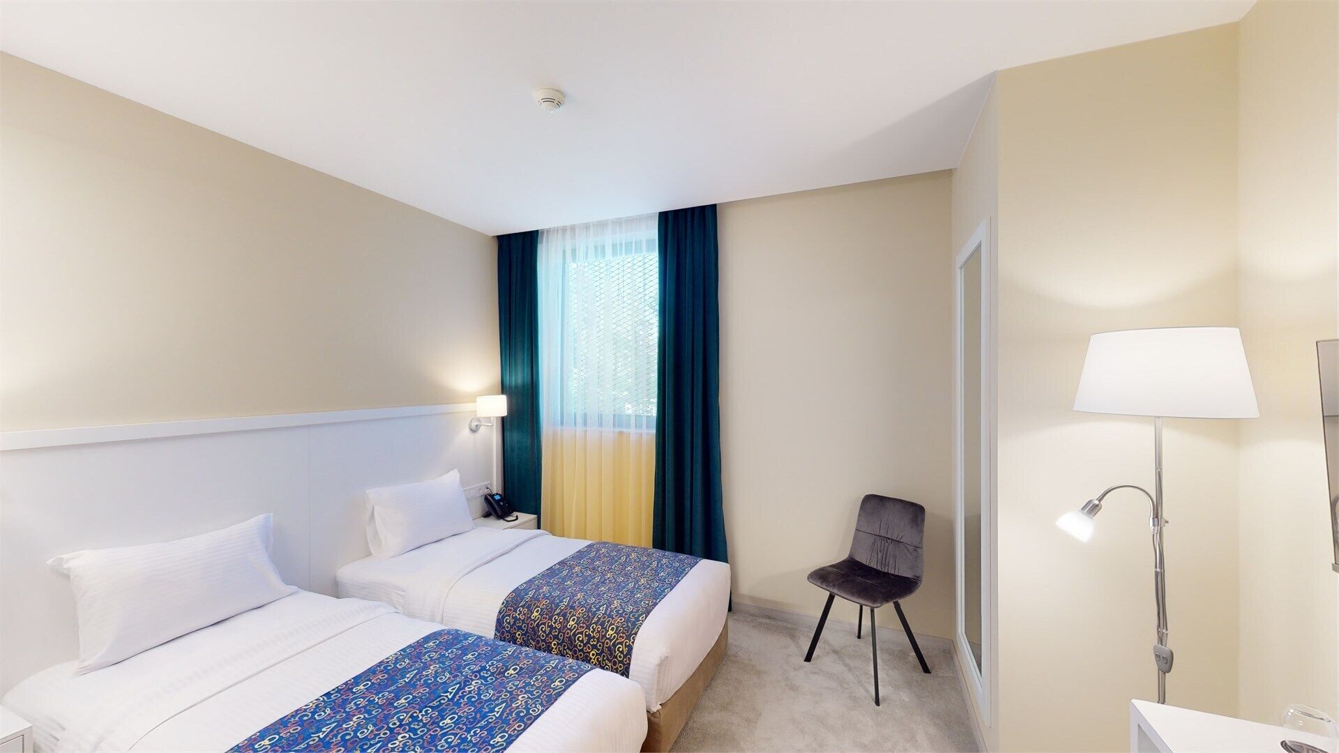 Economy Double or Twin Room | Minibar, in-room safe, iron/ironing board, free WiFi