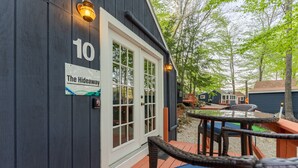 A wooden building with a sign reading "10 The Hideaway." - The Hideaway, lake views & access sleeps 8 Now featuring AC Wi-FI and TV (Alton)
