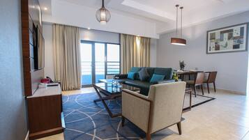 King Suite Seaview With Jacuzzi | Living area | 50-inch LED TV with satellite channels, TV