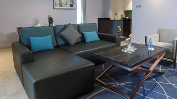 King Suite Seaview With Jacuzzi | Living room | 50-inch LED TV with satellite channels, TV