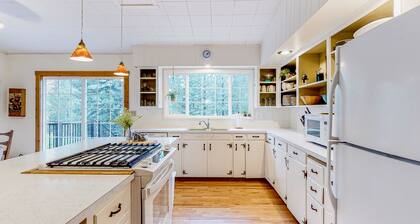 Charming riverfront home with fireplace, patio, grill, & full kitchen