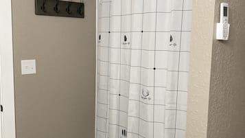 Combined shower/tub, towels, soap, toilet paper
