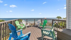 A wooden deck with outdoor seating and a view of the ocean. - Carpe Beachiem Home, Ocean Views & Dual Decks (Ponte Vedra Beach)