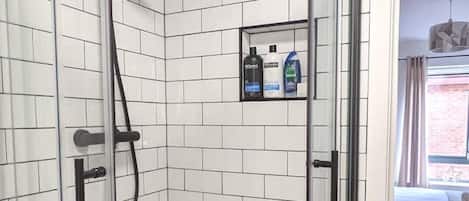 Combined shower/bathtub, hair dryer, towels, soap