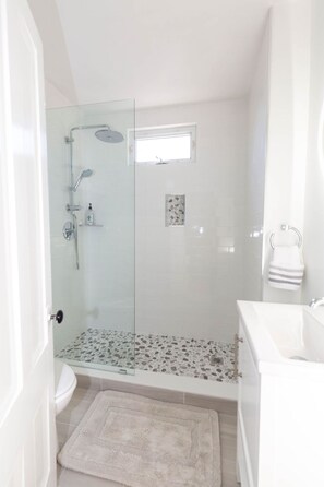 Shower, hair dryer, towels, soap