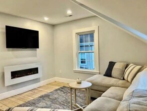 Smart TV, fireplace, books