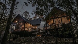 A cabin with a balcony and a staircase, surrounded by trees. - Collins Creek 1 BR- Woodland Hills- 2 acres creek (Broken Bow)
