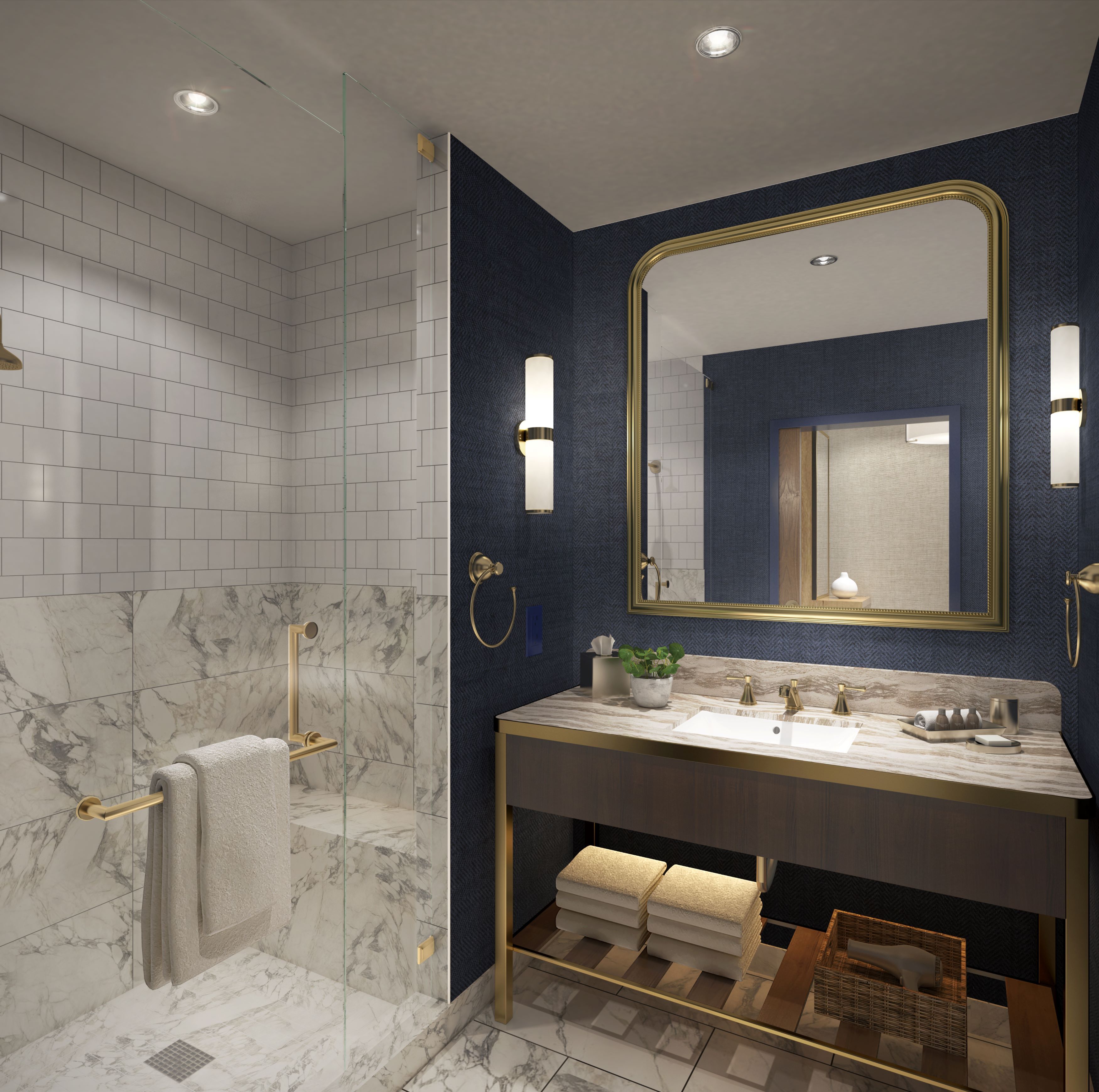 Un baño moderno con ducha envuelta en vidrio, azulejos de mármol, un espejo con marco dorado y encimera de mármol.