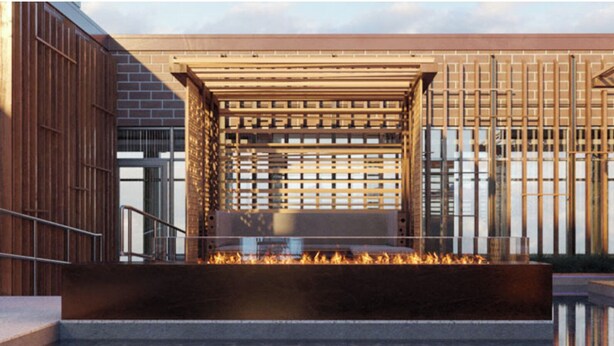 A modern outdoor seating area with a fire feature, a wooden pergola, and a view of the sea. - Luxury 2 Bedroom Arlington Apartment (Arlington)