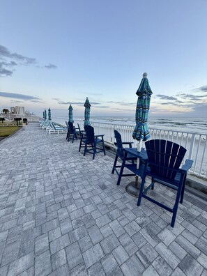 Outdoor dining - "SeaBliss" Oceanfront 1st floor Condo, steps from the ocean! (Daytona Beach)