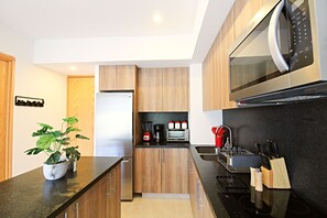 Fridge, microwave, stovetop, coffee/tea maker