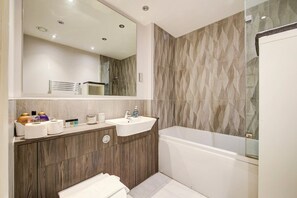 Bathtub, hair dryer, towels