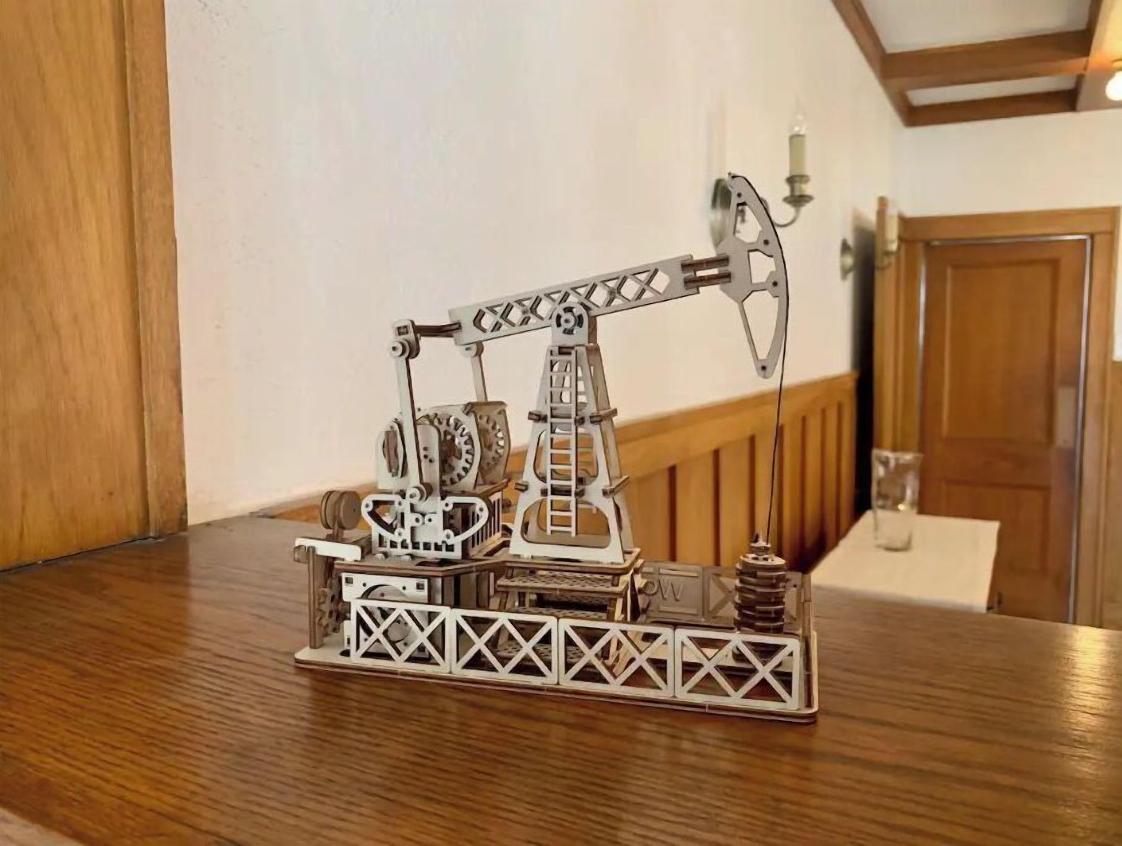 A model of an oil rig on a wooden table.