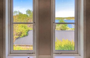 Enjoy a serene view of the surrounding residential area from this room's two windows.
