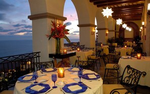 Guests can dine in style with elegant table settings and scenic views.
