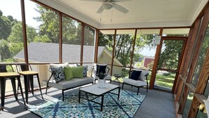 A covered patio with a ceiling fan, a patterned rug, and a view of the surrounding neighborhood. - “New” Elizabethtown Poplar Place! (Elizabethtown)
