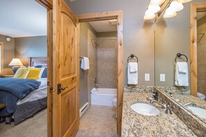 Combined shower/bathtub, hair dryer, towels, soap