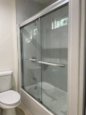 Bathtub, hair dryer, bidet, towels