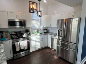 Fridge, microwave, oven, stovetop - 1890's Craftsman Home 5BR 4BA, Sleeps 16+ w 6 TVs. (Omaha)