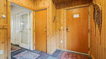 Welcoming Entryway - Warm wood finishes and mountain-inspired details create an inviting first impression as you arrive at your Vermont retreat.