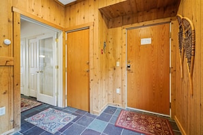 Welcoming Entryway - Warm wood finishes and mountain-inspired details create an inviting first impression as you arrive at your Vermont retreat.