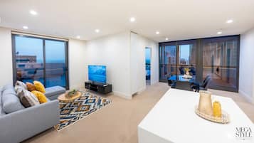 Executive Apartment | Living area | 55-inch LED TV with cable channels