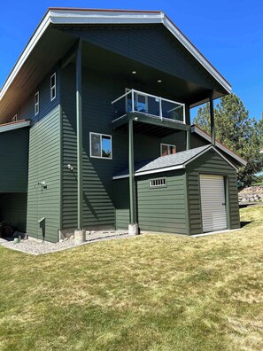 A two-story house with a garage, a balcony, and a small shed. - Lake House In Cascade w/ Hot Tub (Cascade)