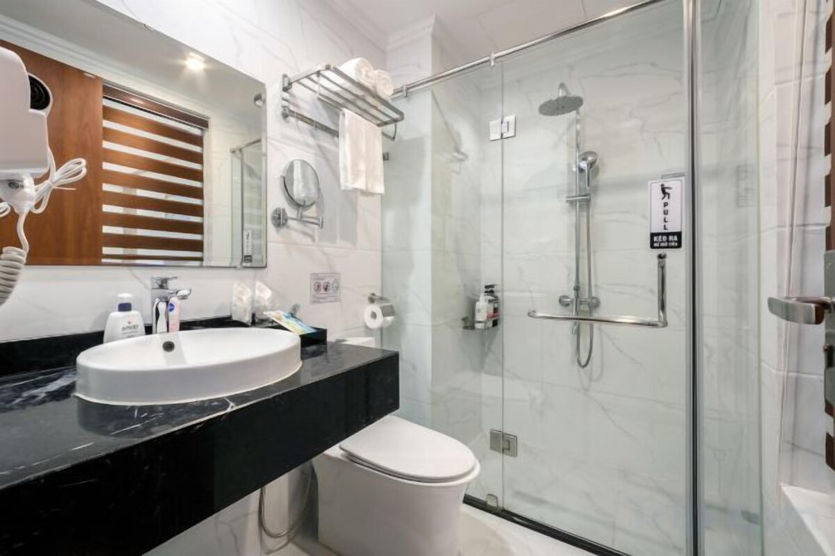 Bathroom | Shower, hair dryer, bathrobes, slippers