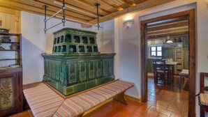 A room with a green cabinet, wooden ceiling, and a bench. - Chalet Kupljenik Near Bled Lake (Bled)
