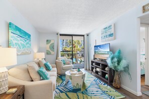 Signature Condo, 2 Bedrooms, Balcony, Pool View | Living room | 55-inch Smart TV with cable channels, TV - Salt and Light Surf & Racquet 204B (Gulf Shores)
