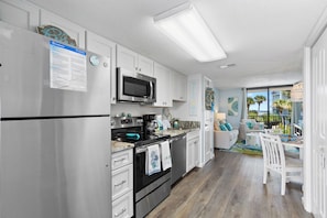 Signature Condo, 2 Bedrooms, Balcony, Pool View | Private kitchen | Fridge, microwave, oven, stovetop - Salt and Light Surf & Racquet 204B (Gulf Shores)