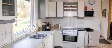 Fridge, stovetop, dishwasher, coffee/tea maker