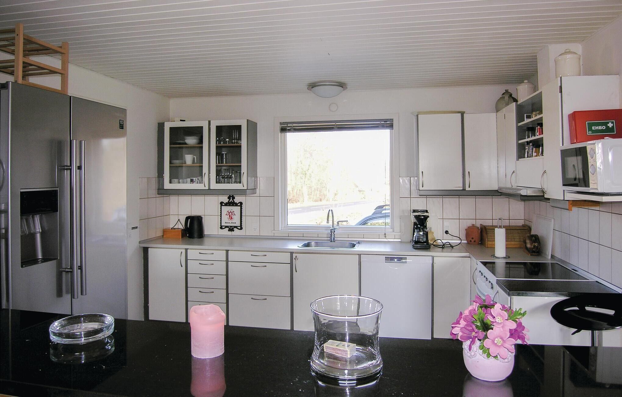 Fridge, stovetop, dishwasher, coffee/tea maker