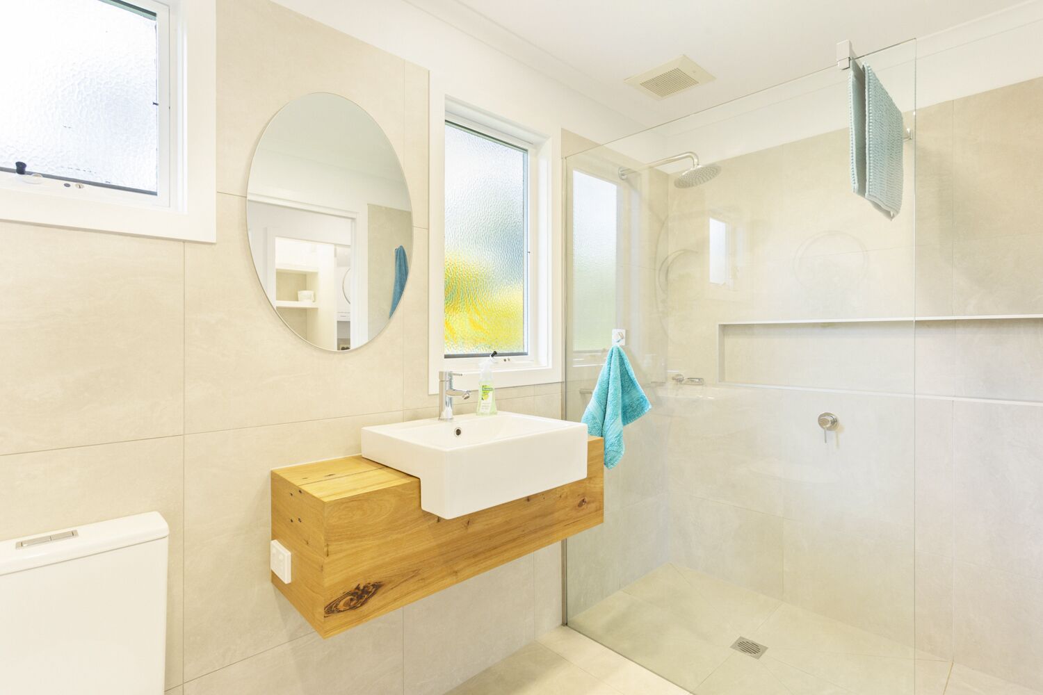 Main bathroom with walk-in shower, basin & toilet.