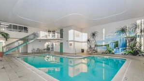 An indoor swimming pool with a staircase leading to an upper level, surrounded by walls with a tropical mural. - ** Prices dropped $300 per week, for all remaining 2023 weeks. Prices shown include the discount. **<br>Avalon Penthouse 803 - 1 of a kind 3 br/3 bath with huge balcony and incredible views. (Ocean City)