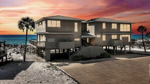 A two-story beachfront house with a balcony and a deck, featuring a view of the ocean. - Gulf-Front with Private Deck and Water Views (Miramar Beach)