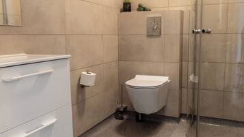 Shower, rainfall showerhead, eco-friendly toiletries, hair dryer