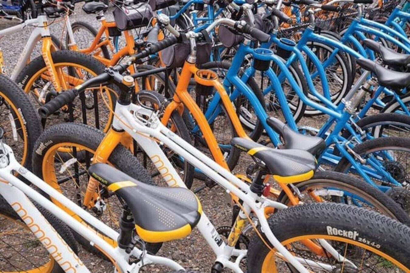A row of bicycles parked closely together.