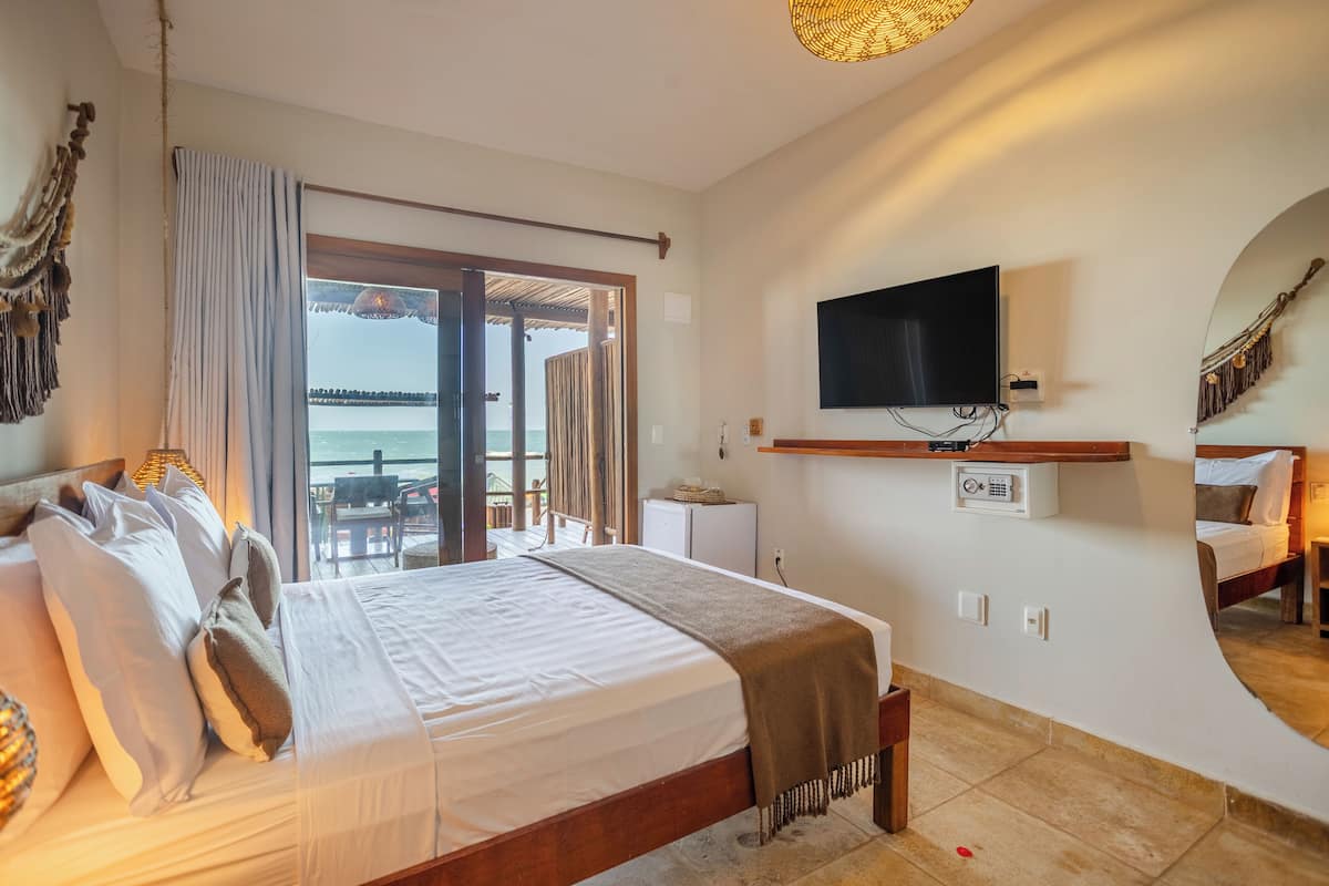Ground Floor Suite with Sea View | Minibar, in-room safe, iron/ironing board, free WiFi