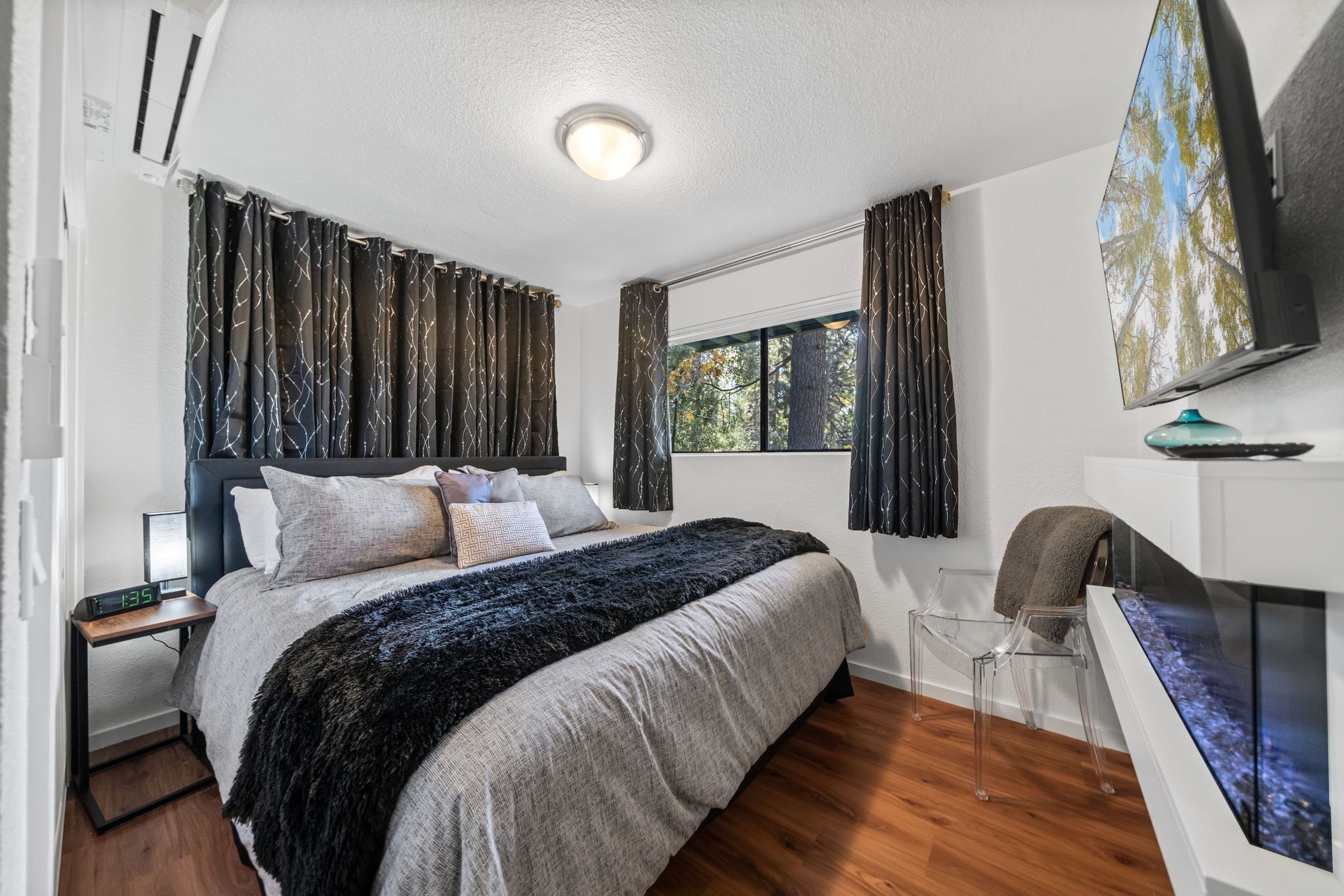 3rd Bedroom with King bed, luxury linens, in room AC/Heat, electric fireplace with Smart TV and work desk