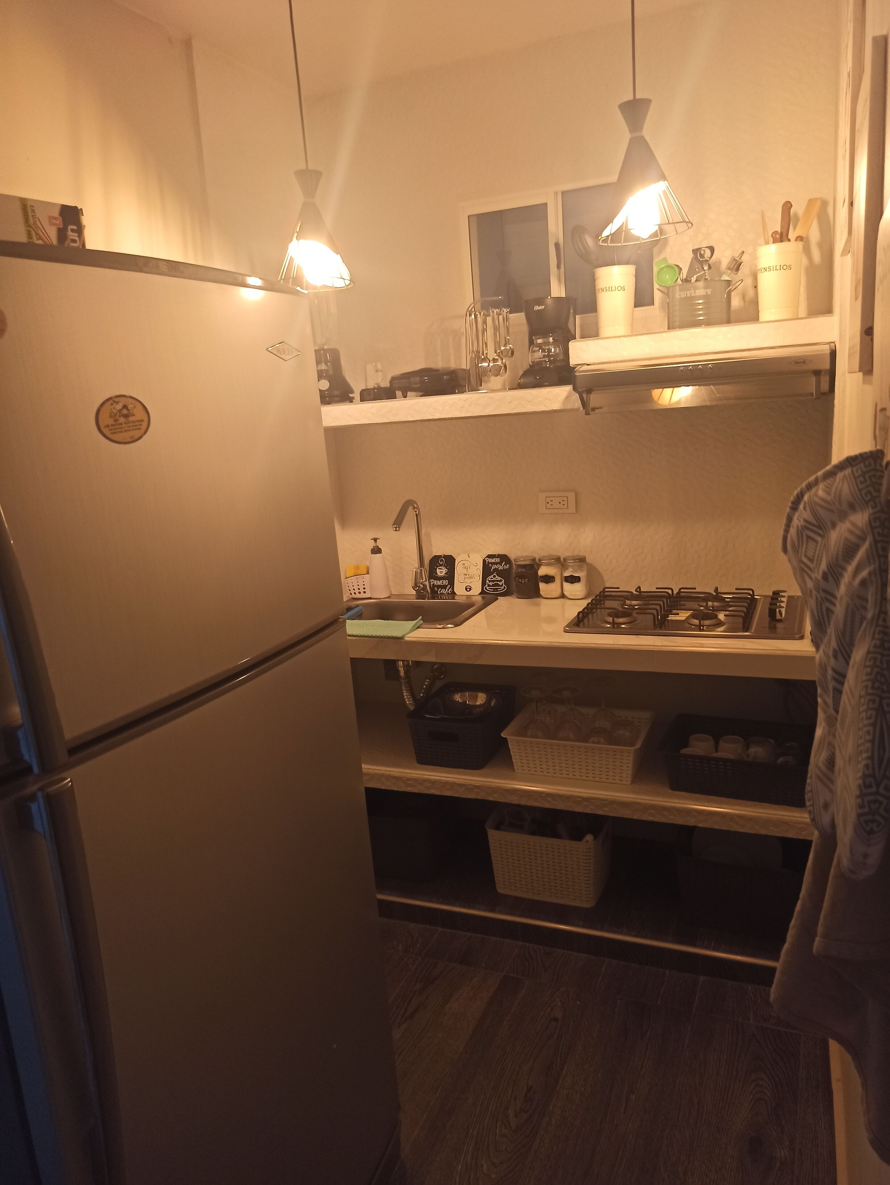 Fridge, coffee/tea maker, cookware/dishes/utensils, dining tables