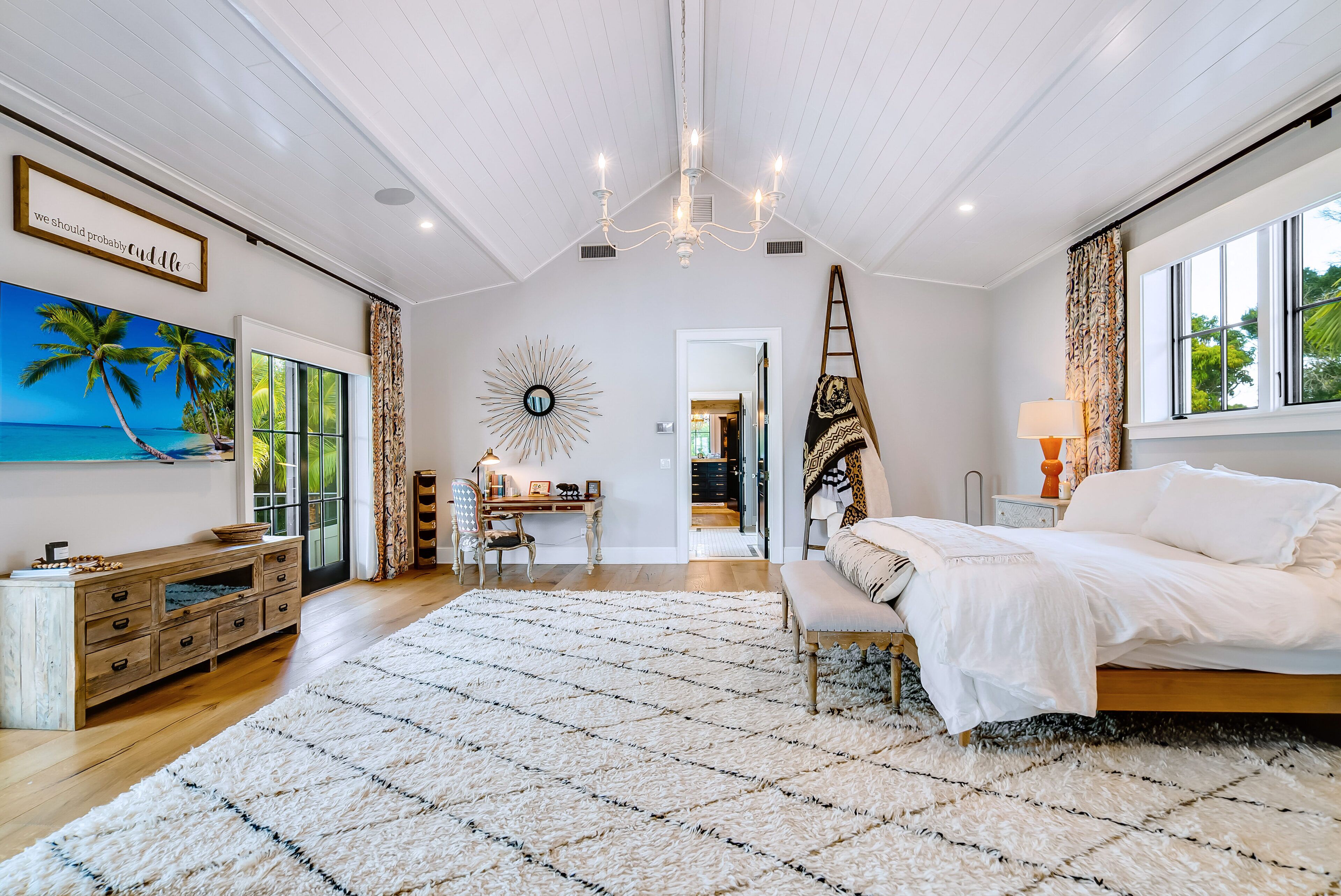 2,000 sq ft Primary Suite includes king bed, library, desk area, deck and more. 
