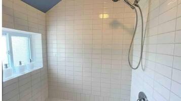 Combined shower/tub, hair dryer, towels, soap