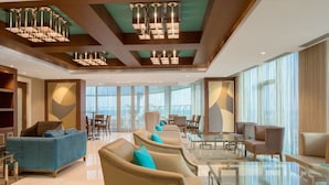 A spacious lobby with modern furniture, large windows, and a high ceiling with unique lighting fixtures. - Four Points By Sheraton Ikot Ekpene (Ikot Ekpene)
